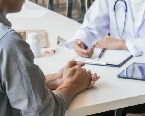 Peptides for physicians — clinician consulting with a patient across a desk